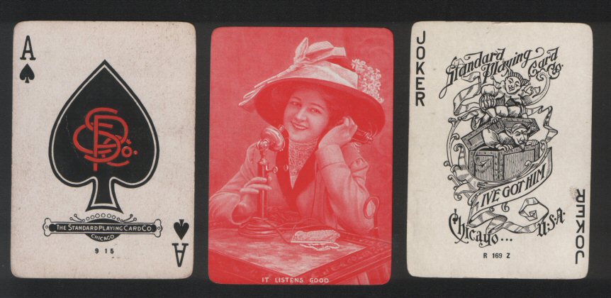 Wide named playing cards . "It Listens Good" by Standard PC co.circa 1920's early wide named deck in monochrome red, gold edges, shows lady with Victorian bonnet using oldstyle telephone. 52 + special "I've got him" Joker. all vg - n